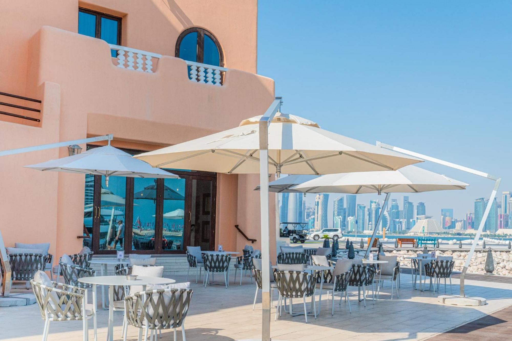 Mina Hotel And Residences By The Torch Doha Exterior foto A patio umbrella