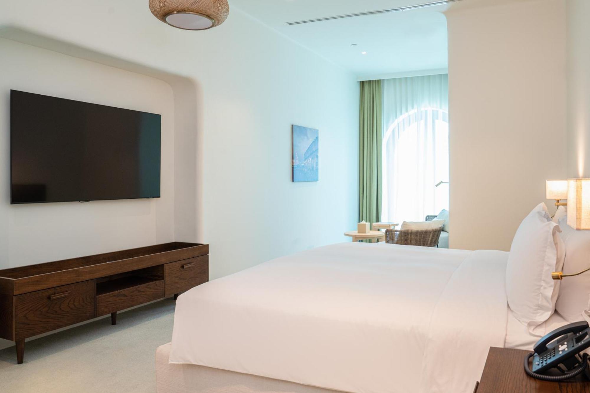 Mina Hotel And Residences By The Torch Doha Exterior foto A bedroom at the hotel